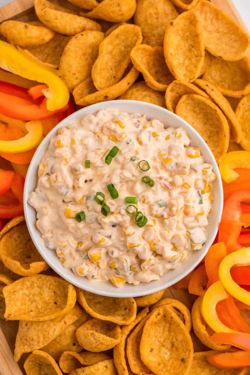 top-down view of the Crack Corn Dip served with chips and peppers.