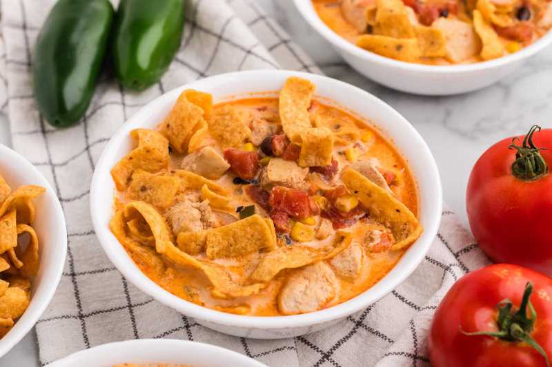 Creamy Chicken Tortilla Soup served in a white bowl.