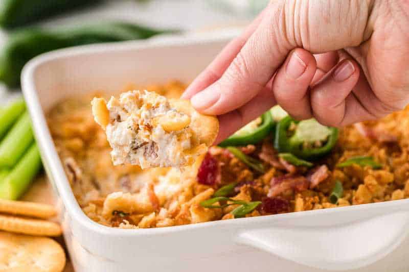 Jalapeno Popper Dip being served on a Ritz Cracker.