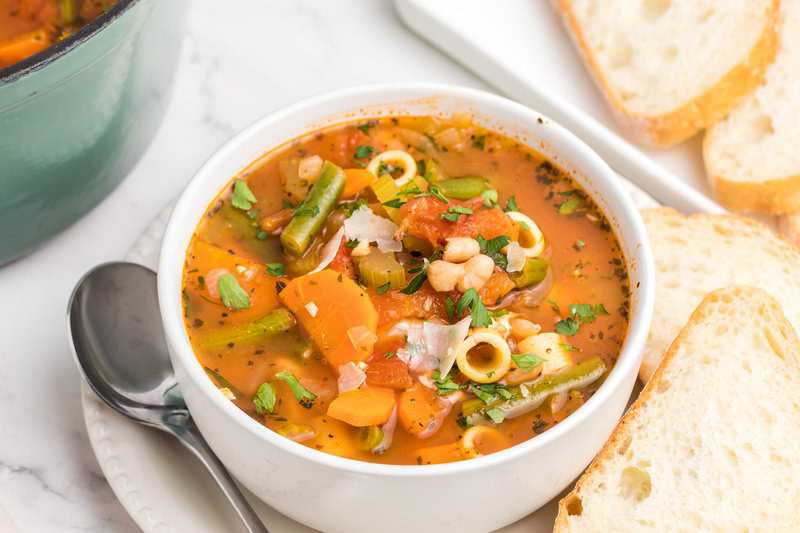 Minestrone Soup served in a white bowl.