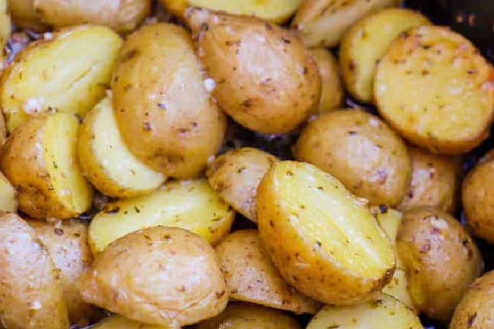 closeup of the slow cooker Parmesan Garlic Potatoes.