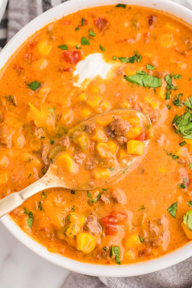closeup of the Beef Nacho Soup served in a white bowl.