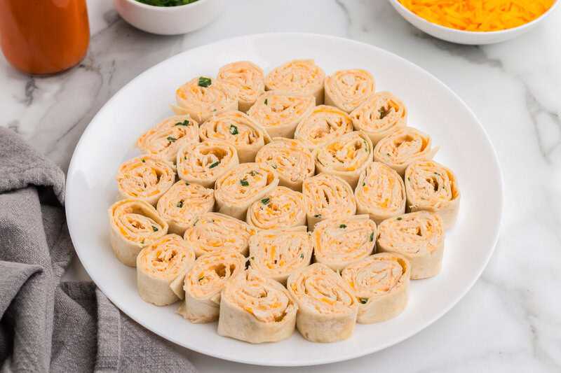 Buffalo chicken Pinwheels served on a white plate.