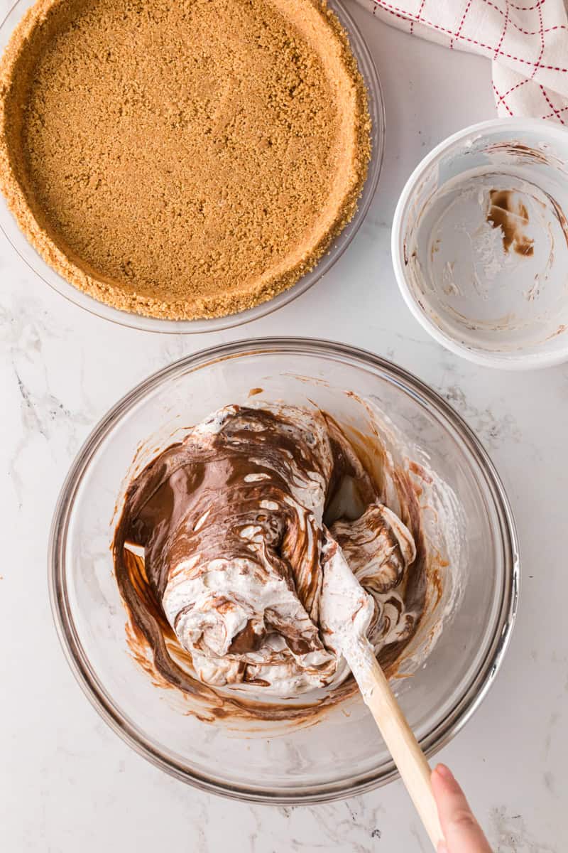 mixing the melted chocolate and cool whip together.