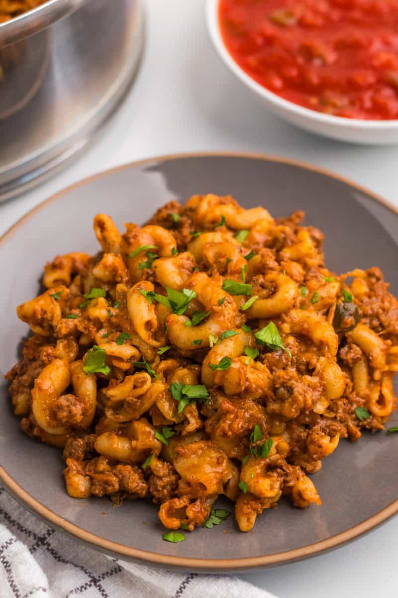 One Pan Taco Pasta served on a gray plate.
