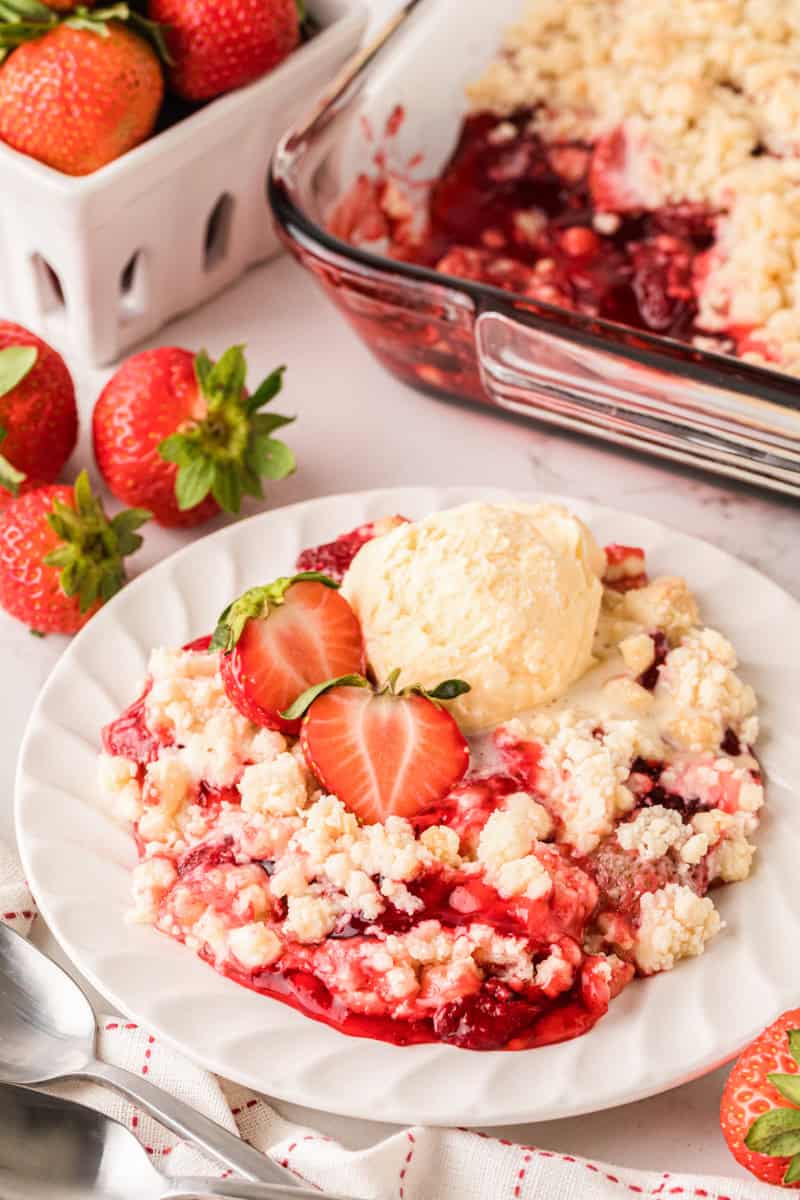 the Strawberry Cheesecake Dump Cake served on a white plate.