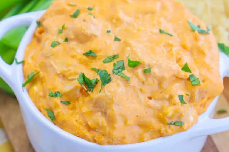 top-down closeup of the Buffalo Chicken Dip served in a white bowl.