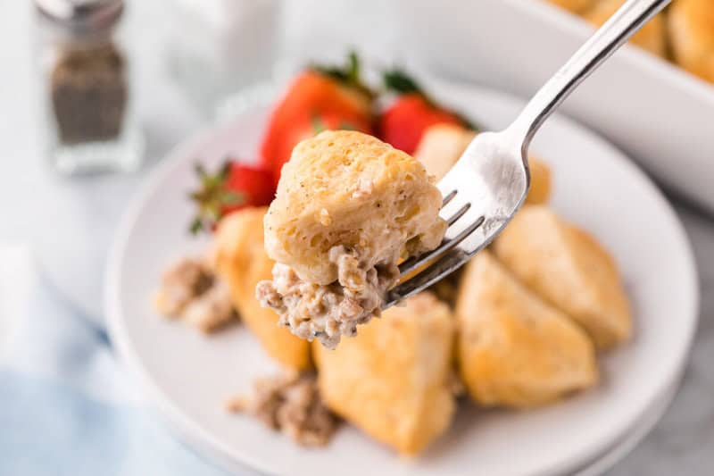 Biscuits and Gravy Casserole closeup on a fork.