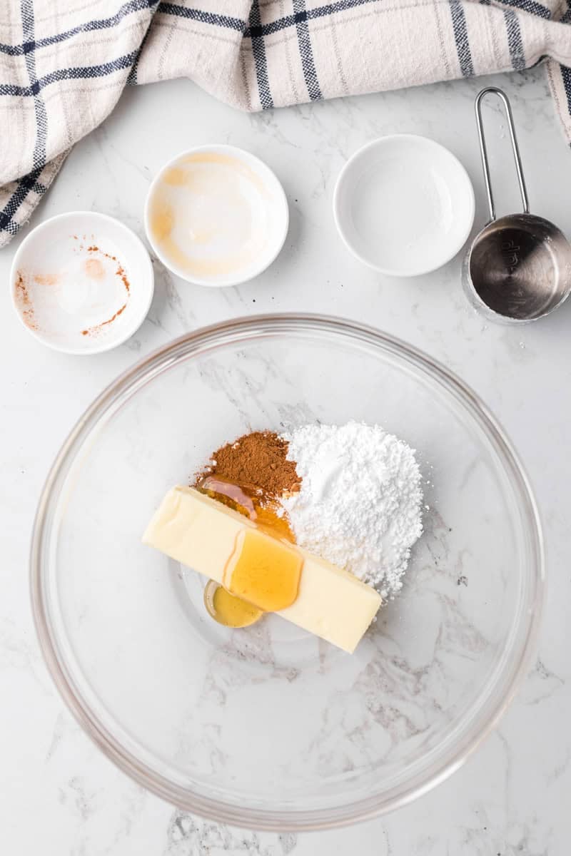 butter, cinnamon, powdered sugar and honey in a large glass bowl.