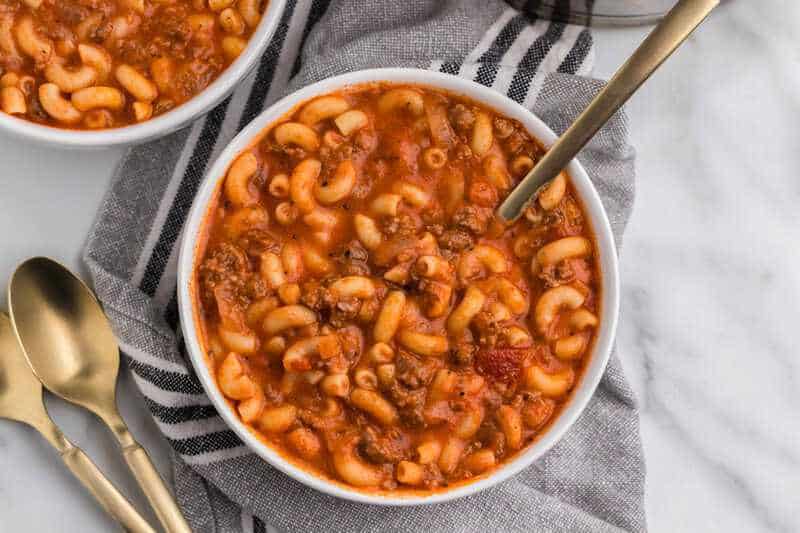 Beef and Macaroni Soup served in a white bowl.