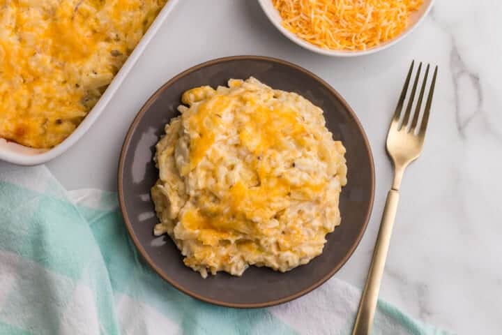 Hashbrown Casserole served on a gray plate.