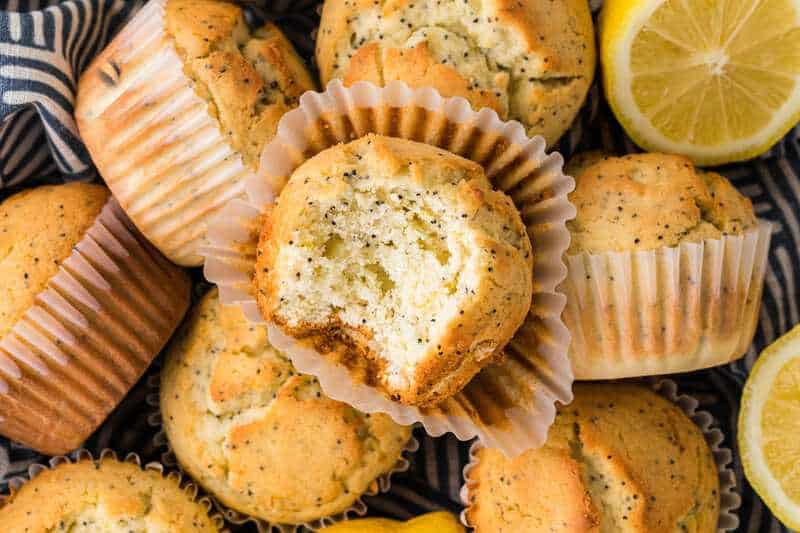 bunch of Lemon Poppyseed Muffins in a basket.