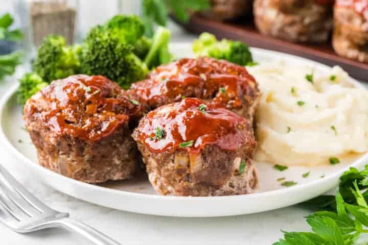 Mini meatloaf served with mashed potatoes and broccoli.