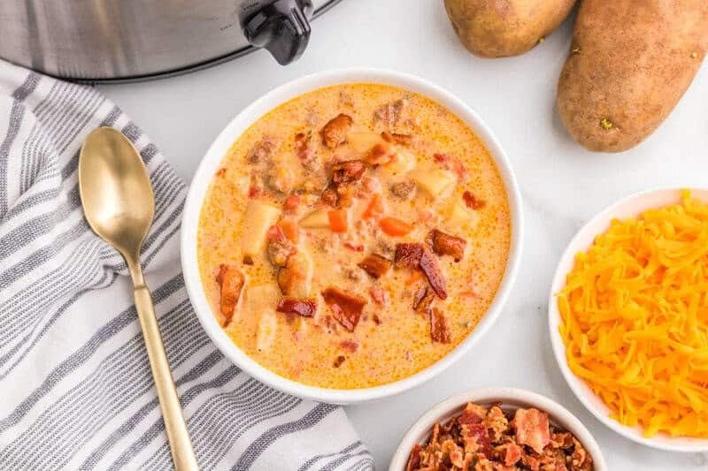 top-down view of the Slow Cooker Cheeseburger Soup served in a white bowl.