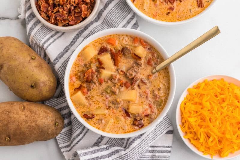 Slow Cooker Cheeseburger Soup served in a white bowl.