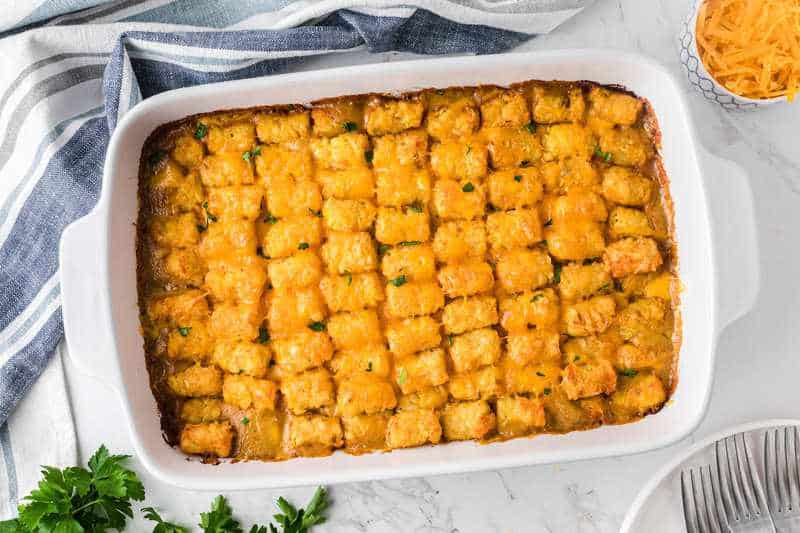 tater Tot Casserole served in a white casserole dish.
