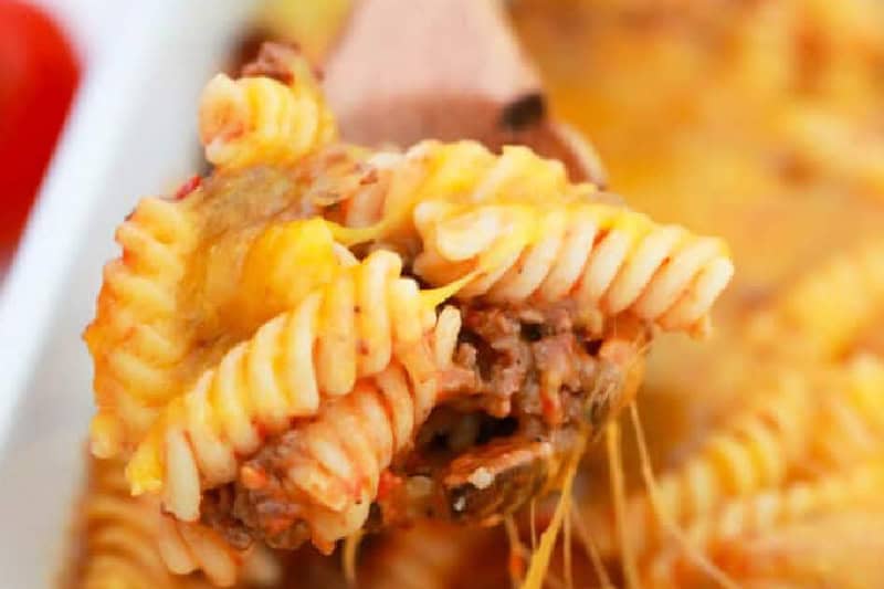 closeup of the Cheeseburger Casserole on a wooden spoon.