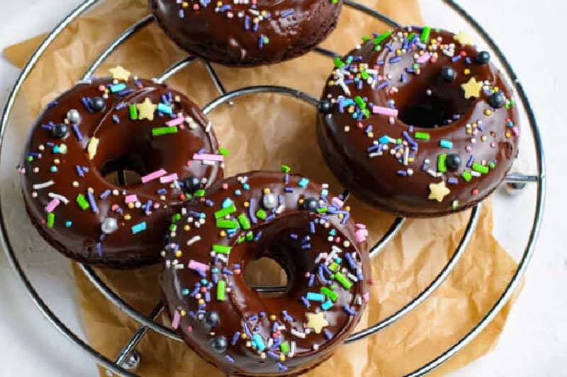 Baked Chocolate Donuts on a wire rack.