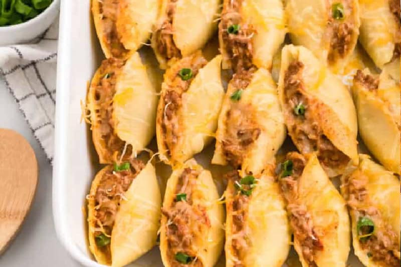 Taco Stuffed Shells in a white baking dish.