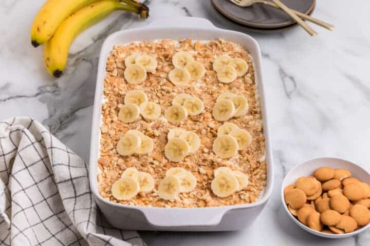 Banana Pudding Poke Cake in a white cake pan.