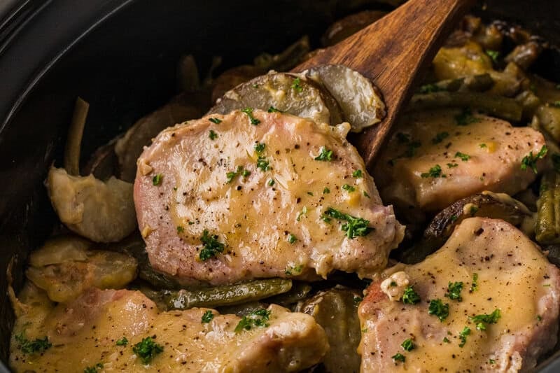 serving the pork chops and potatoes out of the slow cooker.