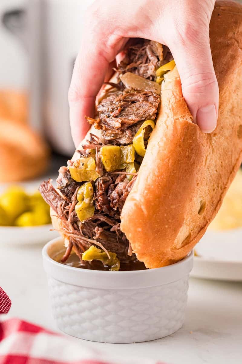 Dipping the sandwich in Au Jus.