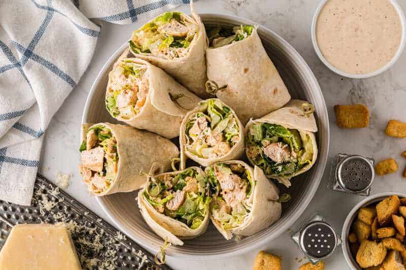 Top-down view of the Chicken Ceasar Wraps served in large bowl open faced.
