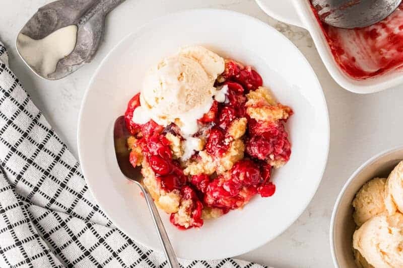 Cherry Cobbler served on a white plate.