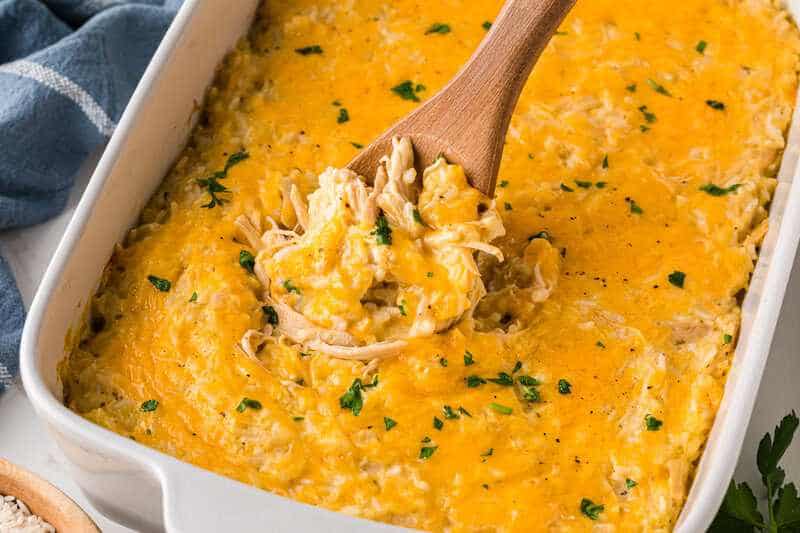 Chicken and Rice Casserole baked in a white baking dish.