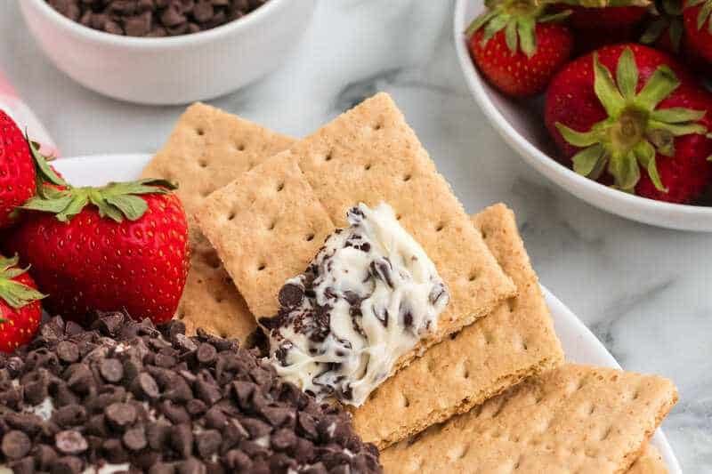 Chocolate Chip Cheeseball served with graham crackers and strawberries.