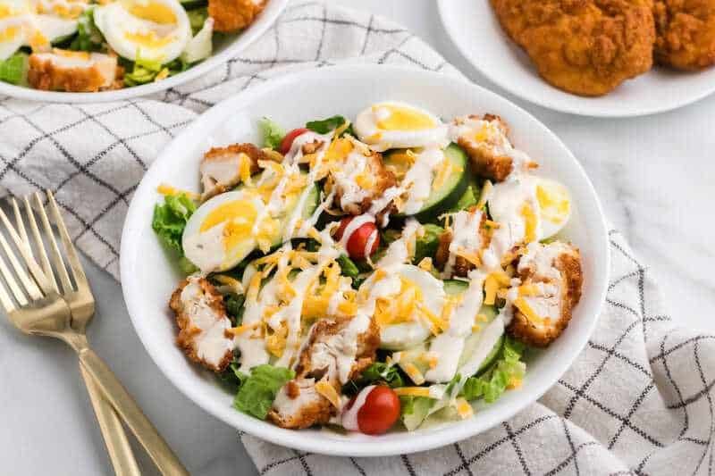 closeup of the Crispy Chicken Salad served on a white plate.