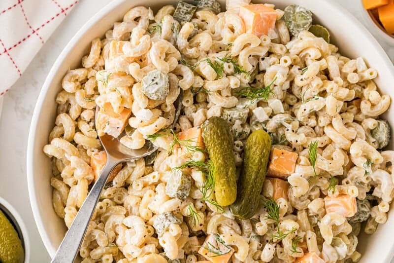 closeup of the Pickle Pasta Salad being served out of a white bowl.
