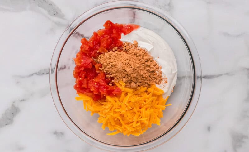 all ingredients for the dip in a glass mixing bowl.
