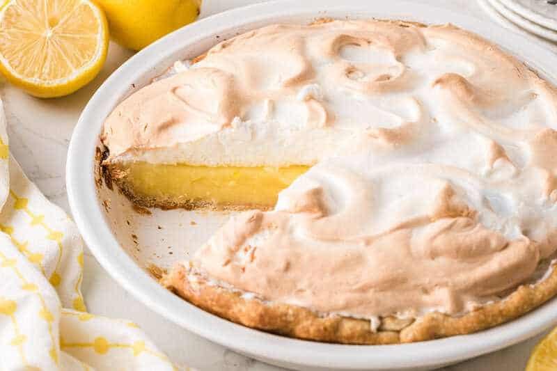 Lemon Meringue Pie with a slice out of it.
