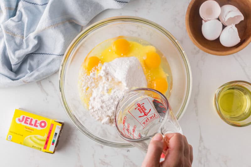 mixing together the cake mix, pudding mix, oil, water and eggs.