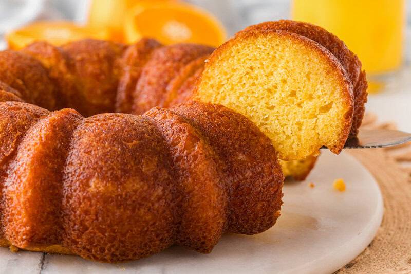serving a slice of the Orange Juice Cake.