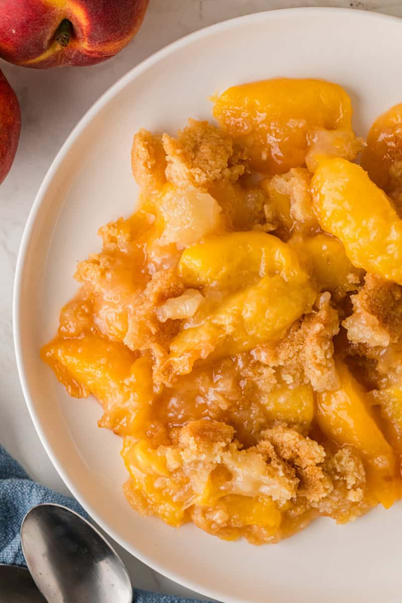 top-down view of the Peach Cobbler served on a white plate.