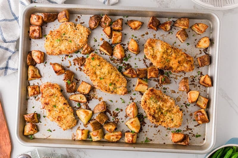 top-down view of the sheet pan pork chops and potatoes.