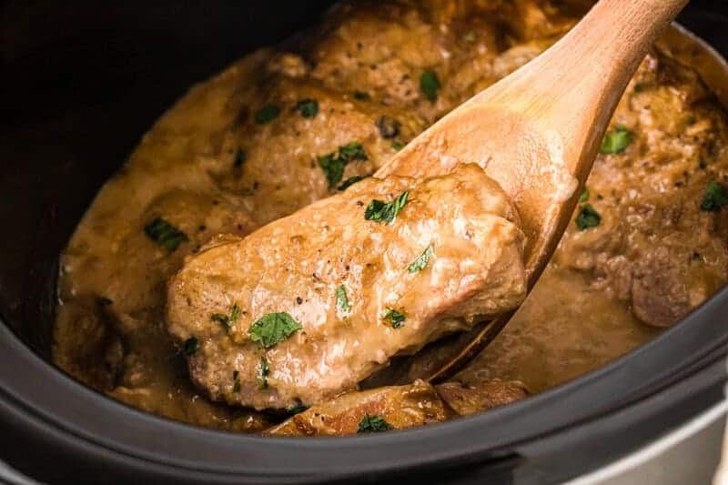 Serving the Slow Cooker Smothered Pork Chops out of the slow cooker.