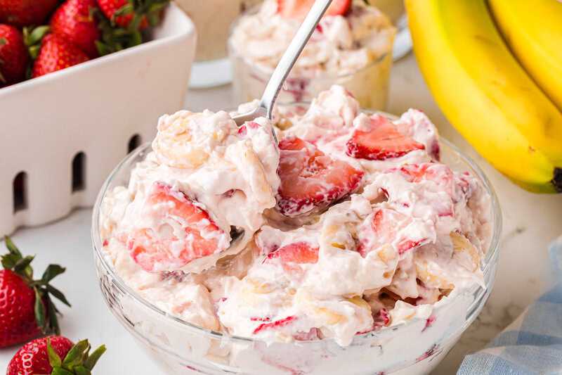 Strawberry Banana Cheesecake Salad served in a glass bowl.