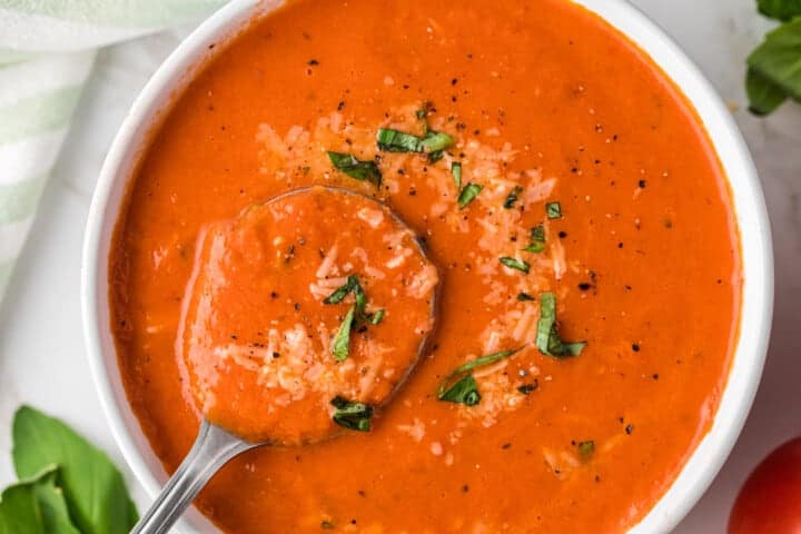 top-down view of the Slow Cooker Tomato Soup served in a white bowl.