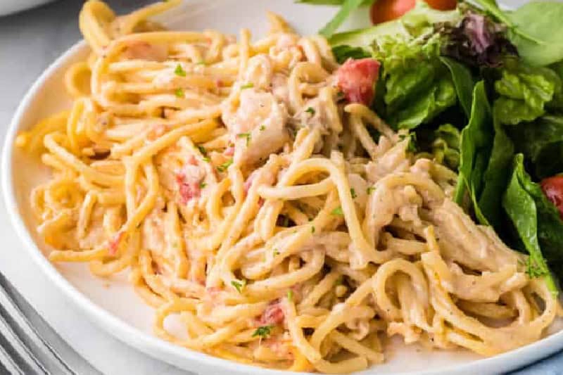 closeup of the Chicken Spaghetti served with a salad.