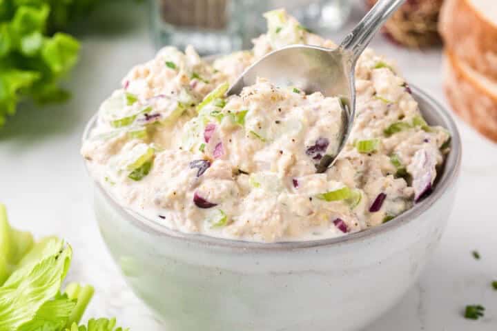 Tuna Salad made in a large white bowl.