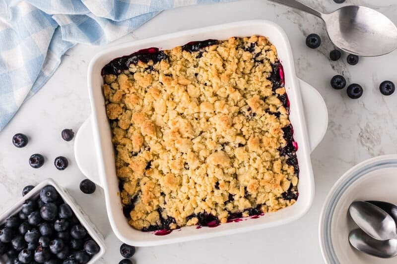 top-down view of the baked blueberry cobbler.