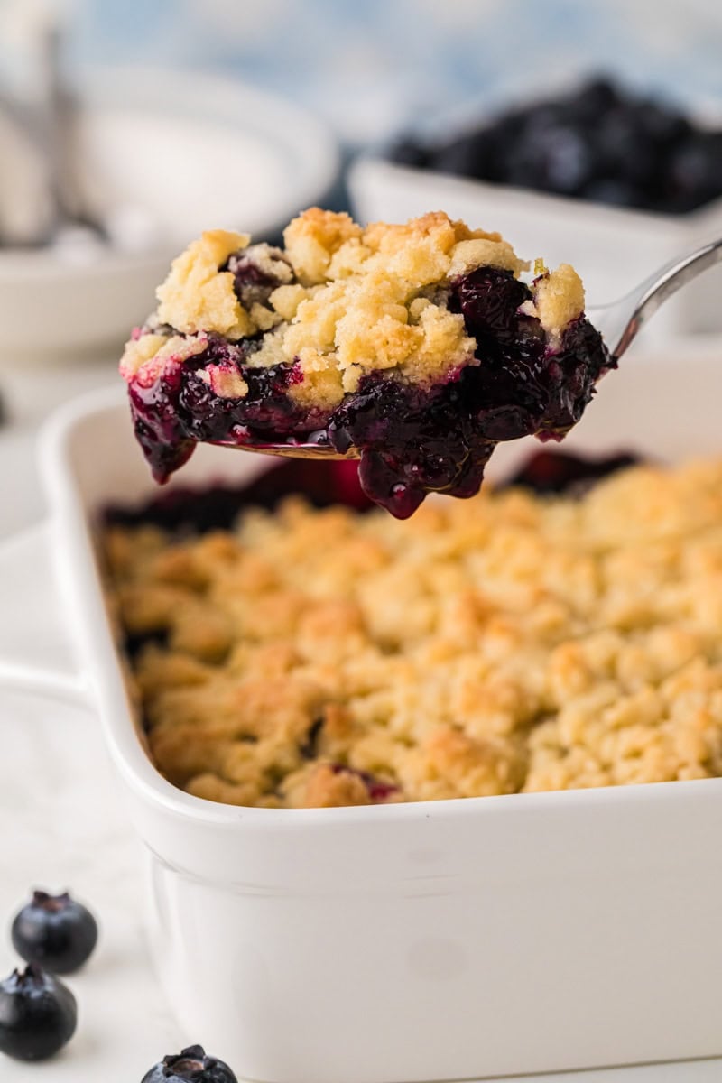 serving the blueberry cobbler out of the baking dish.