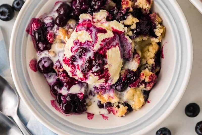 top-down view of the blueberry cobbler served with ice cream.