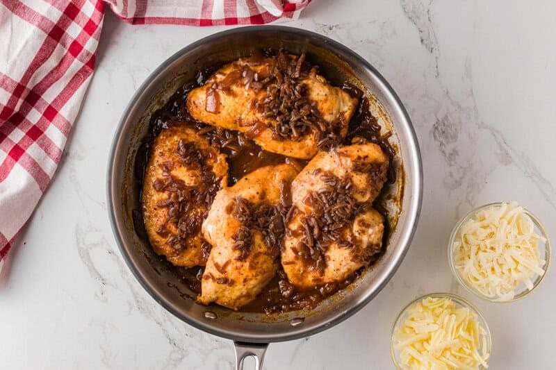 cooking the chicken in the French Onion sauce.