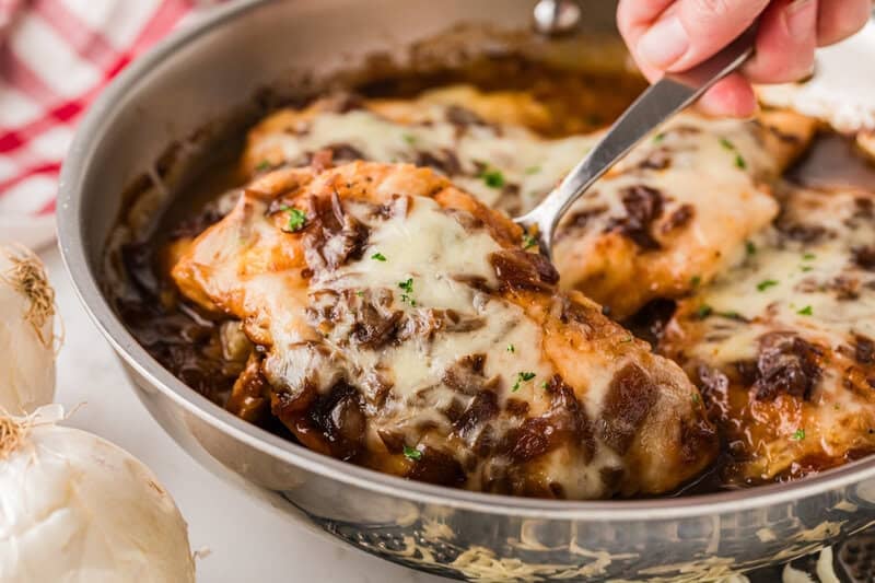 serving the French Onion Chicken out of the pan.