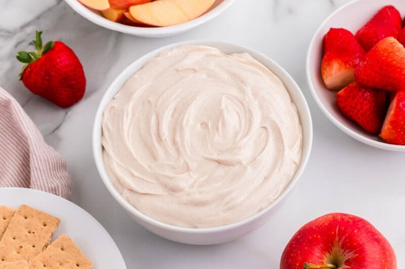 closeup of the Snickerdoodle Dip served in a white bowl.