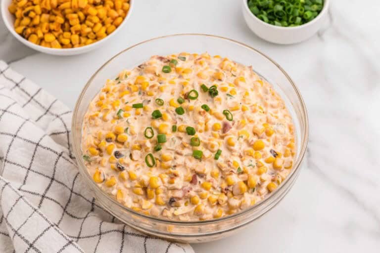Creamy crack corn dip in a skillet served warm with tortilla chips.
